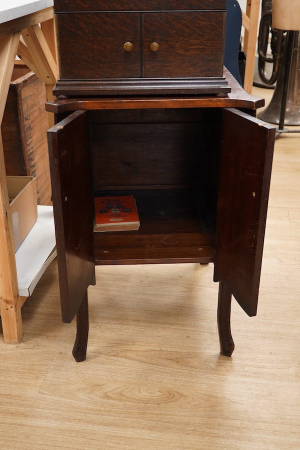 Two gramophone players; an oak cased HMV tabletop gramophone on a similar style mahogany gramophone record stand, height of stand 72.5cm, together with a May-Fair Deluxe Model portable gramophone player. Condition - poor